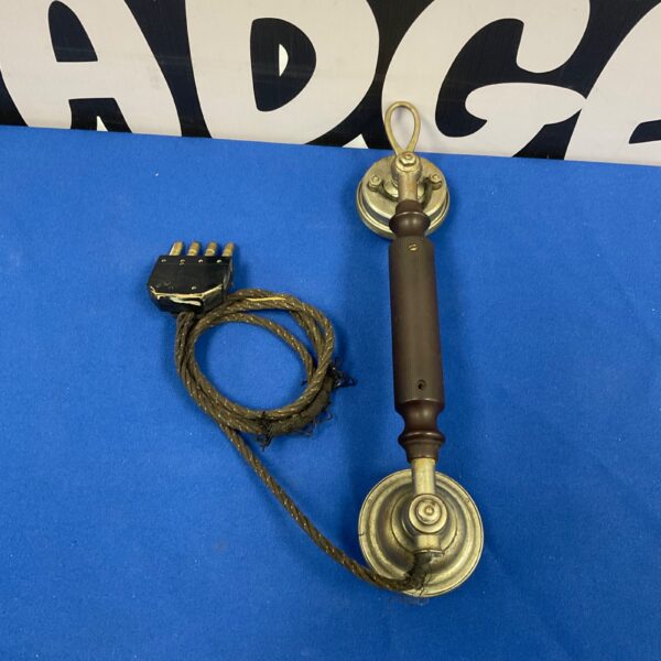 Antique LM Ericsson Swedish telephone with dark wood handle.