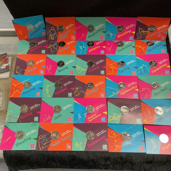 Complete set of uncirculated London 2012 Olympic 50p coins in cards.