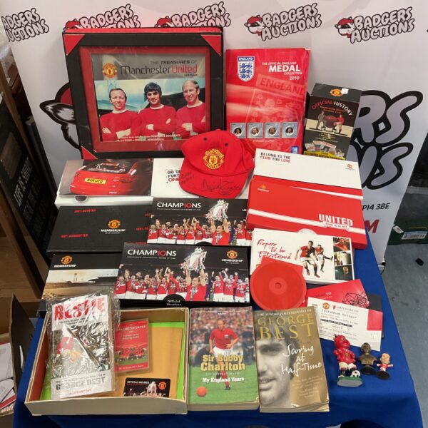 Vintage Manchester United memorabilia collection with signed cap.
