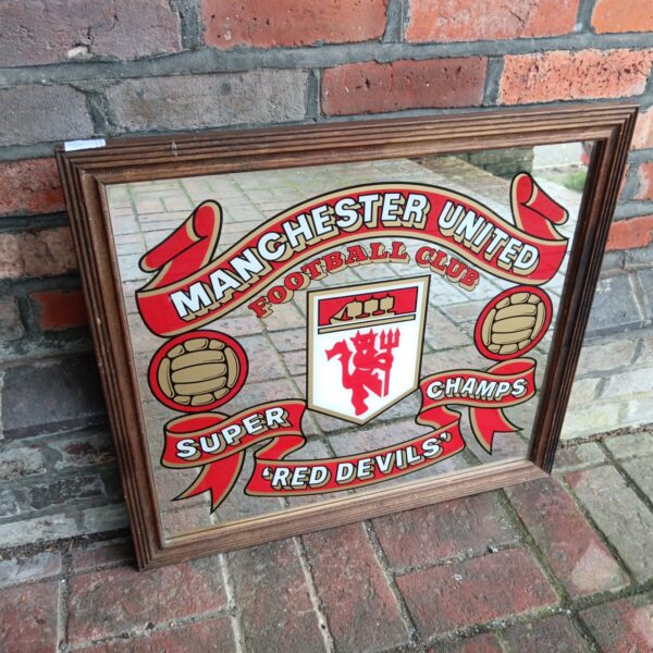 Vintage Manchester United Super Champs football mirror.