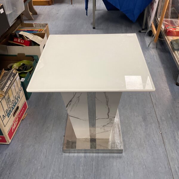 Stylish marble effect lamp table with glass top and chrome base.