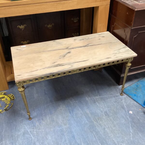 Vintage marble top coffee table with elegant brass legs.