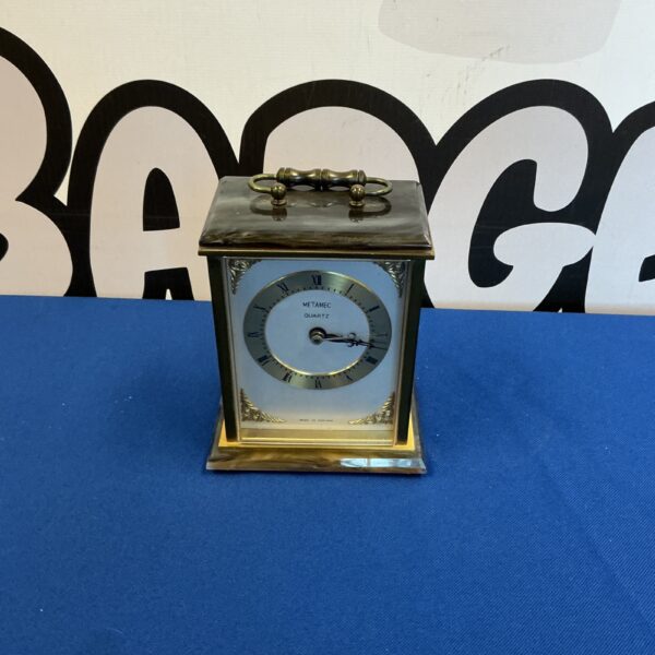 Vintage Metamec quartz carriage clock with brass case and Roman numerals.