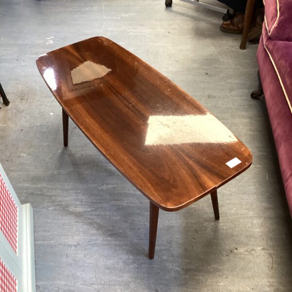 Vintage mid-century mahogany coffee table with tapered legs.
