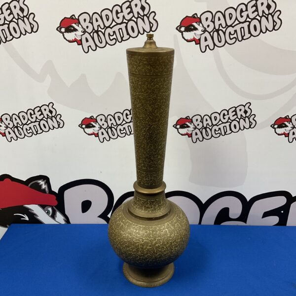 Intricate Middle Eastern brass table lamp with engraved Islamic patterns.