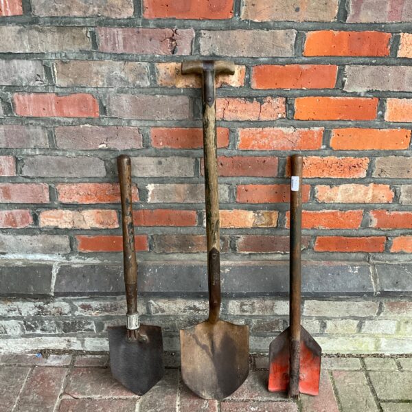 Vintage military shovels including a Lucas Ltd model.