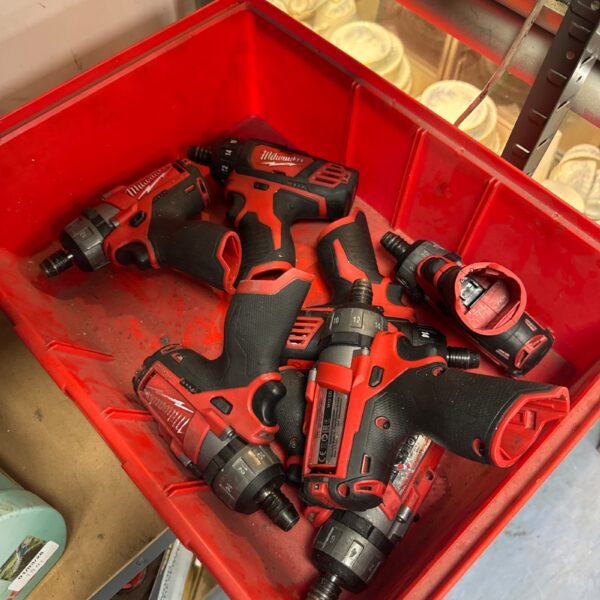 Milwaukee impact driver lot, cordless power tools for DIY projects.