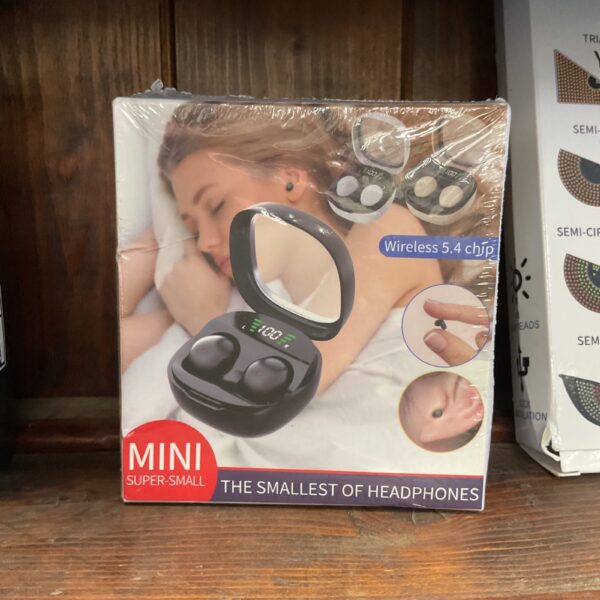 Black mini wireless headphones presented for auction.