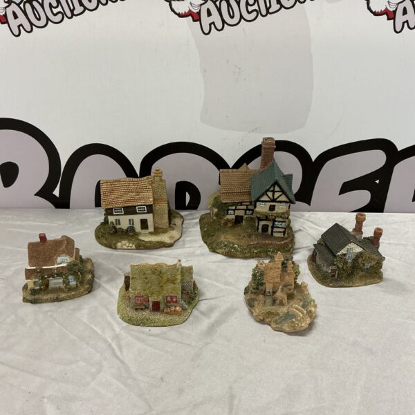 Lot of six miniature cottage ornaments for collectors.