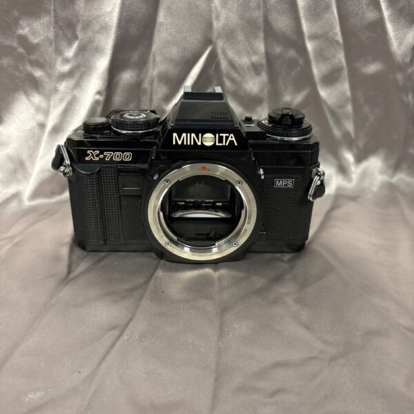 Front view of a vintage Minolta Z-700 35mm film camera.