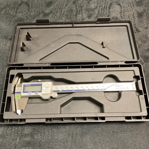 Mitutoyo digital caliper in open case, coolant proof design.