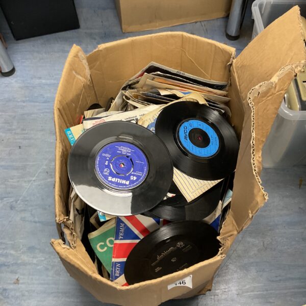 Mixed lot of vintage 7-inch vinyl records for collectors.