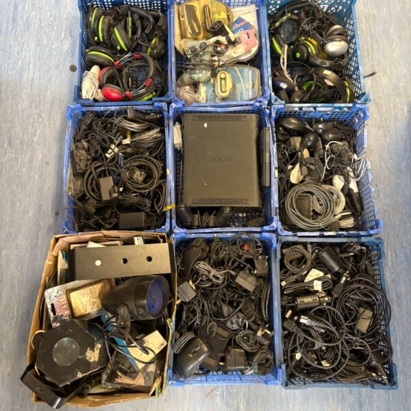 Mixed lot of cables, power supplies, and gaming headsets.