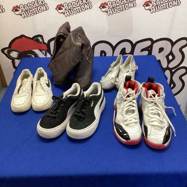 Mixed footwear lot including Nike trainers and athletic shoes.
