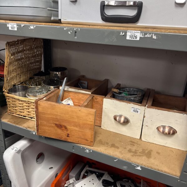 Overview of a mixed hardware lot with baskets and a box.