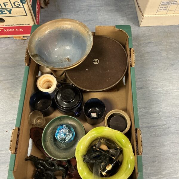 Mixed lot of vintage collectibles and curios on display.