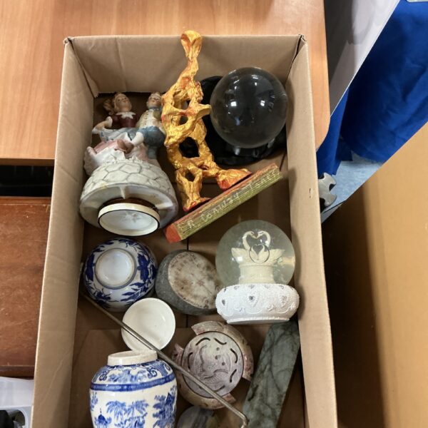 Mixed ornament lot with porcelain figurines and a snow globe.