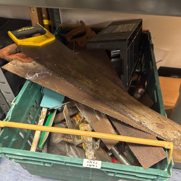Mixed tool lot featuring various saws and hand tools.