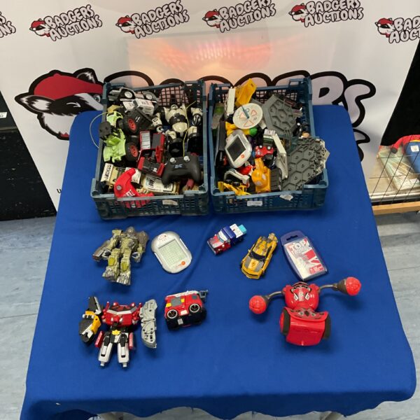 Mixed toy lot with Team GB Top Trumps and Transformers figures.