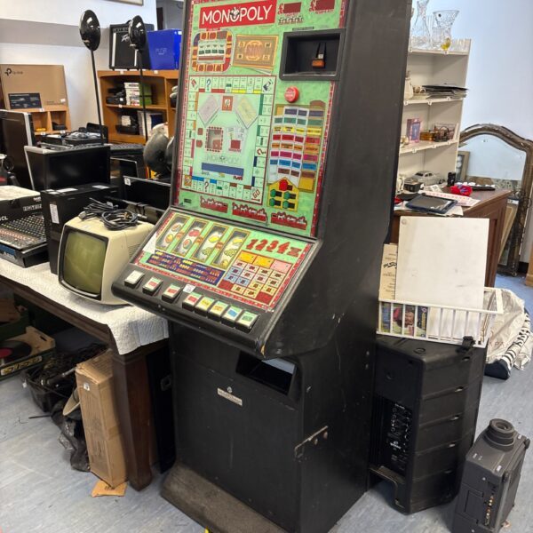 Vintage Monopoly fruit machine for repair, classic arcade game.