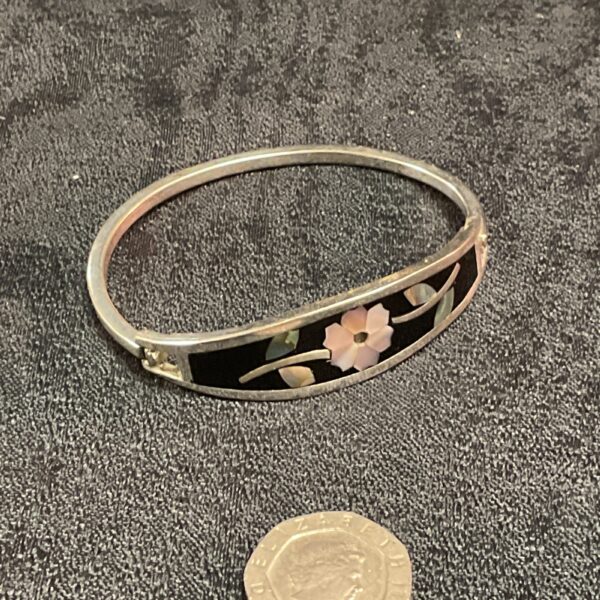Vintage mother of pearl and enamel bracelet with floral design.