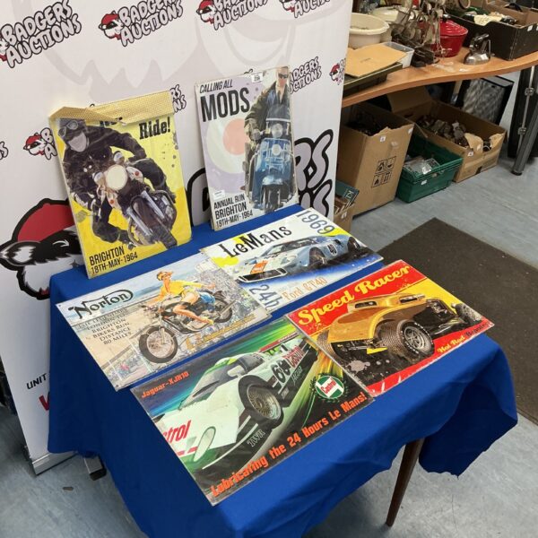 Collection of vintage reproduction motorcycle wall plaques.