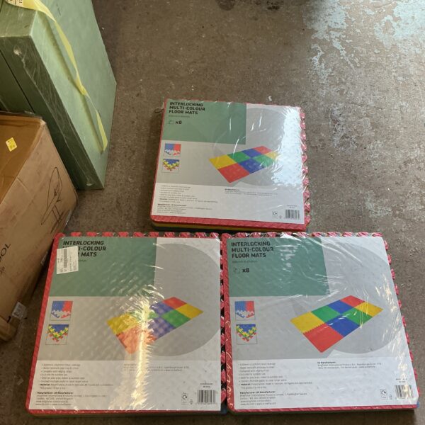 Sealed packs of multi coloured interlocking foam floor panels for playrooms.