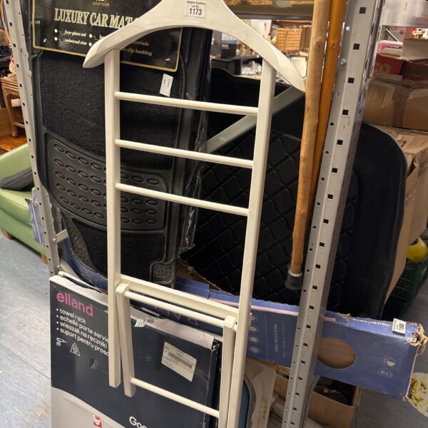 Multi-tier plastic clothes hanger for organised wardrobe storage.