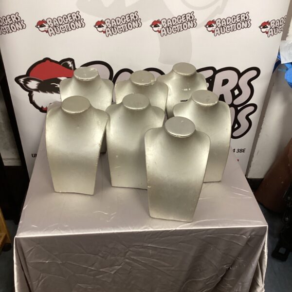 Lot of plastic necklace display stands for jewellery presentation.