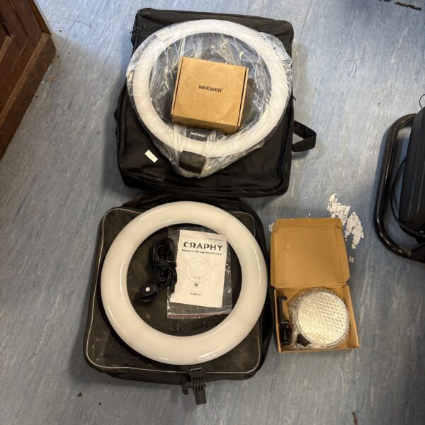 Two LED ring lights in cases, Neewer and Craphy brands.