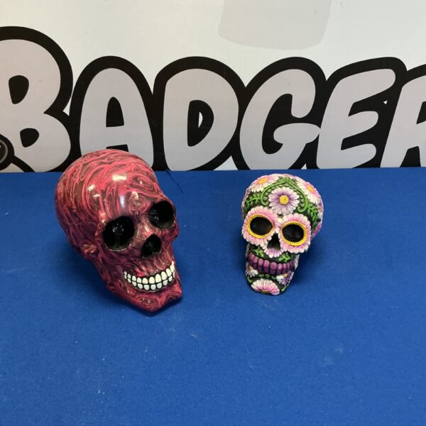 Vibrant floral Nemesis Model Skull, gothic Day of the Dead decor.