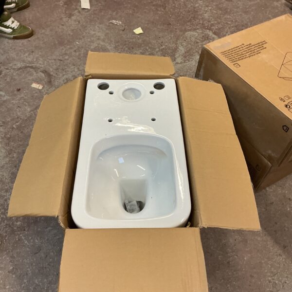 New white ceramic toilet bowl in original packaging.