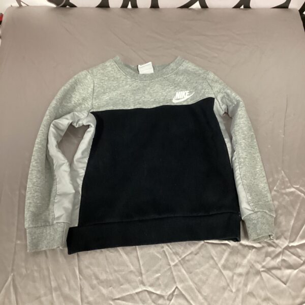 Grey Nike kids jumper medium with swoosh logo.