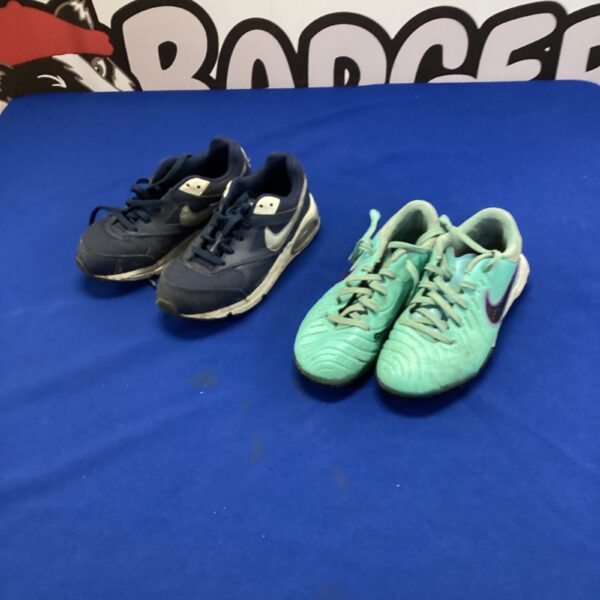 Nike trainers and astroturf football boots in UK size one.