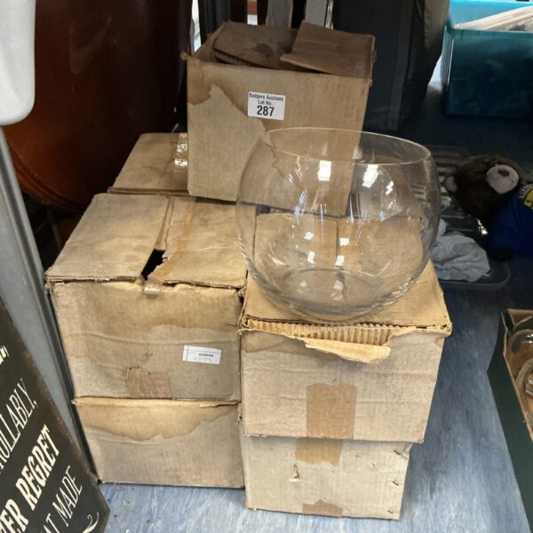Stacked vintage glass bowls in cardboard packaging.