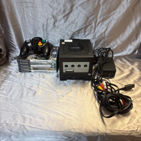 Nintendo Gamecube console with controller and games setup for retro gaming.