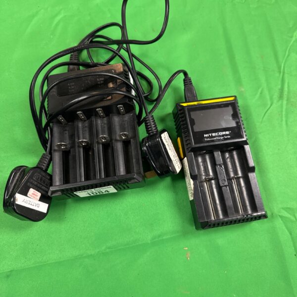 Two battery chargers including a Nitecore model with power adapter.