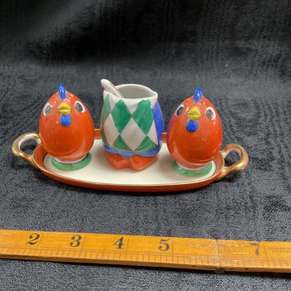 Vintage Noritake cruet set with bird figurines on tray.