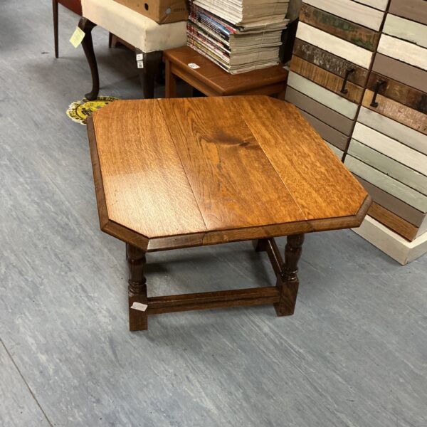 Vintage oak swivel top table with hexagonal top and turned legs.