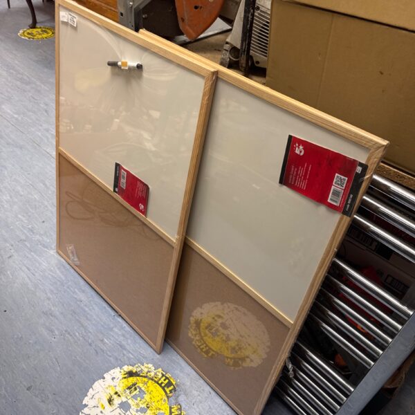 Pair of new office notice boards with cork surfaces.