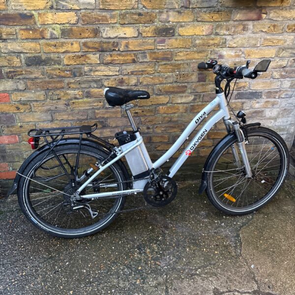 Silver Oxygen Diva electric bike with rear rack and mudguards.