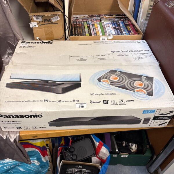 Panasonic home theatre system with multiple boxes and components.