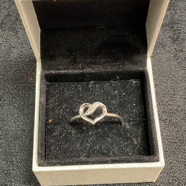 Pandora silver ring size S with heart design.
