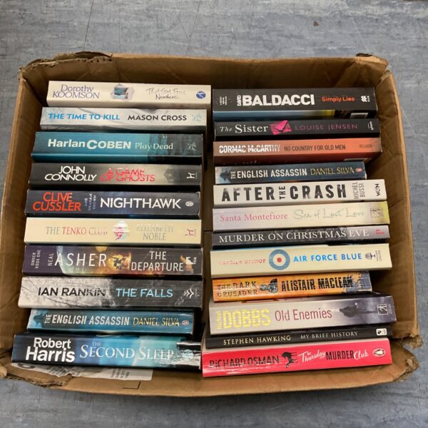 Collection of paperback books including Clive Cussler and David Baldacci titles.