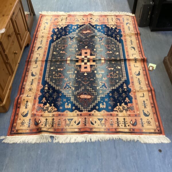 Intricate Persian silk rug with animal and geometric patterns.