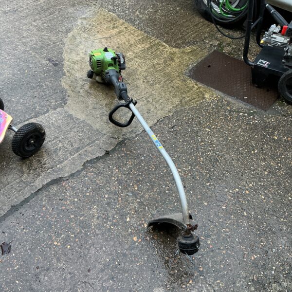 Used petrol strimmer for garden maintenance and landscaping tasks.