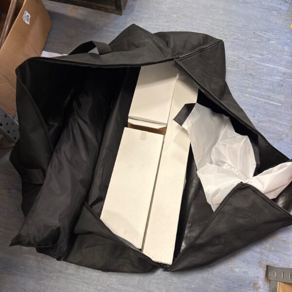 Black carrying case containing a photography umbrella set.