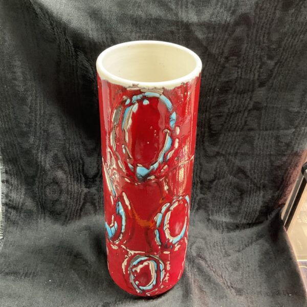 Vibrant red Poole Pottery Delphis vase with crab design.
