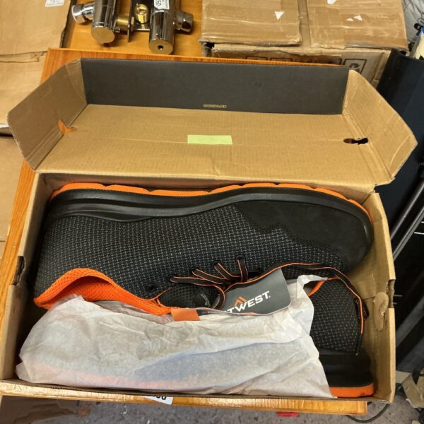 Portwest safety trainers in an open cardboard box.