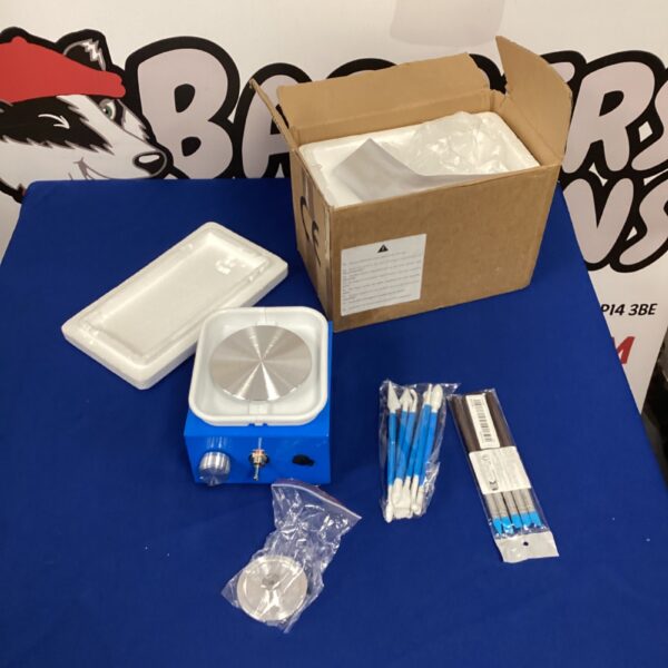 Overview of the pottery wheel kit with tools and clay.